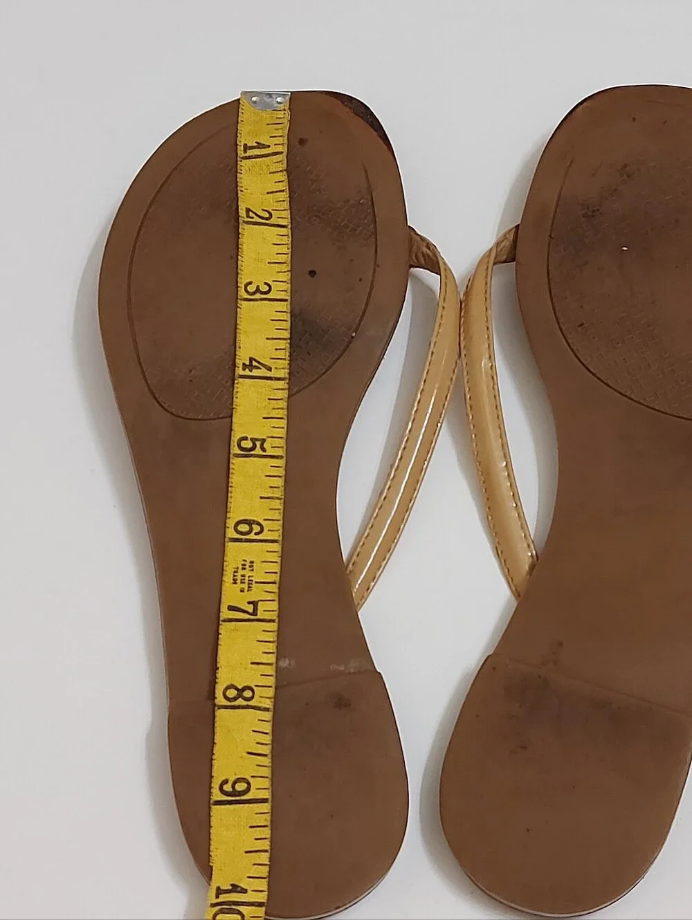 Tory Burch Brown Leather Flip Flop Sandals with Tan Straps and Gold Medallion